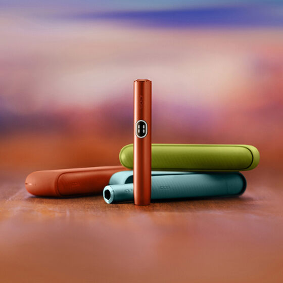 A jade green IQOS ILUMA PRIME Pocket Charger and Holder.