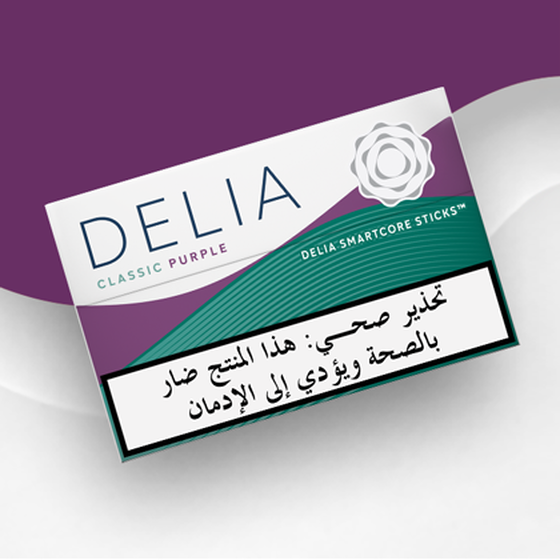 IQOS ILUMA DELIA Classic Purple tobacco sticks package on a wavy purple and white background