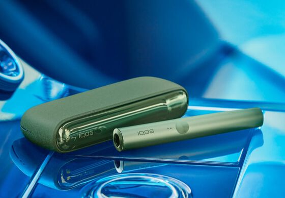 A moss green IQOS ILUMA device.