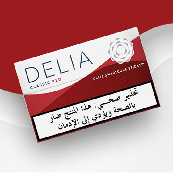IQOS ILUMA DELIA Classic Red tobacco sticks package on a wavy red and white background