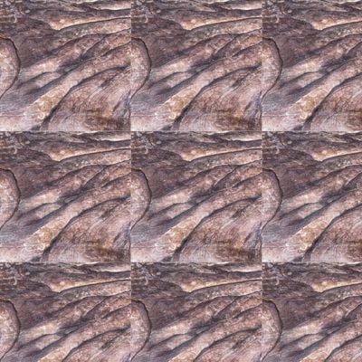 Arrangement of textured stone tiles featuring natural, flowing grooves and ridges in varying shades of brown and gray, creating an organic and rugged appearance.