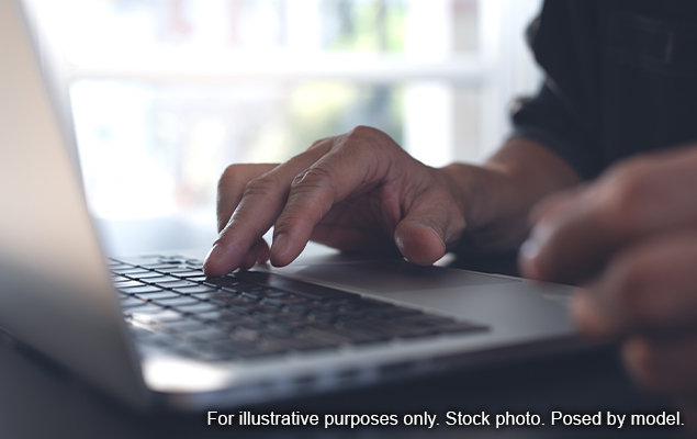 Person typing on laptop
